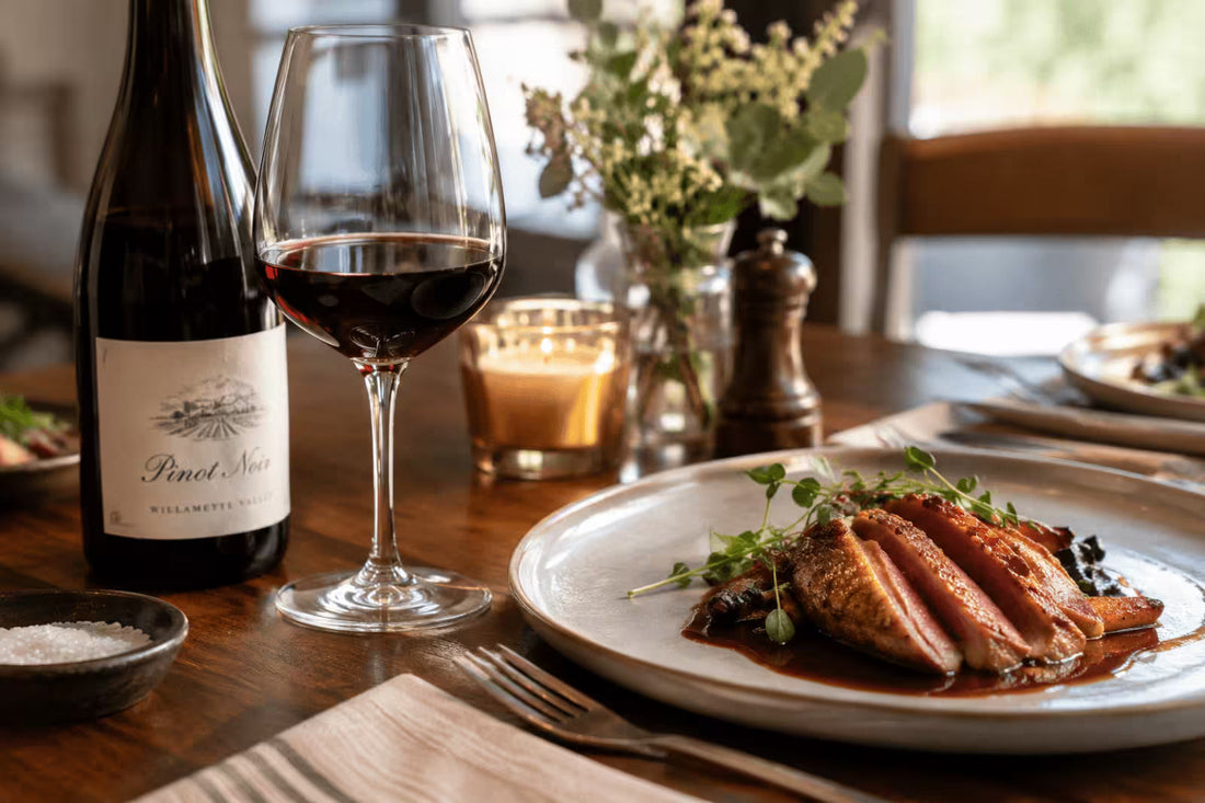 Sliced pan-seared duck breast served with red wine sauce, paired with a glass of Pinot Noir on an elegant dining table