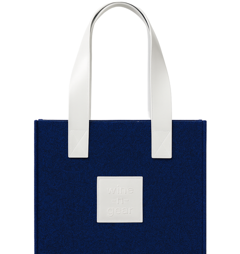Blue tote bag with white handles and a visible brand logo on a white background