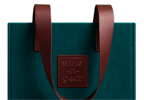 Green box with brown leather handles and a visible brand logo on a light gray background